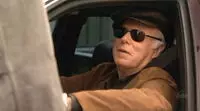 Cooper dans sa voiture