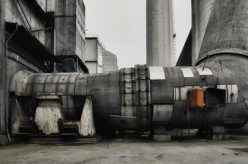 Precipitator, induced draught fan, and flue gas stack