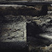 Thumb Gravestone and bones in an abandoned church